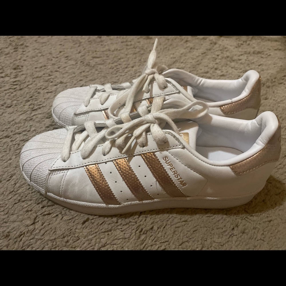 Gold and white adida shell toe